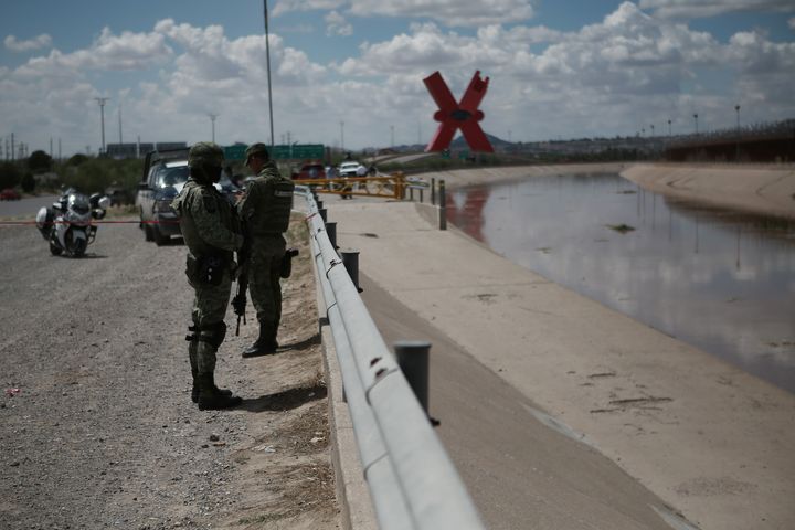 Police officers and soldiers after a 5-year-old girl died in the Rio Grande while trying to cross the border in Ciudad Juarez, Mexico on August 22, 2022. 