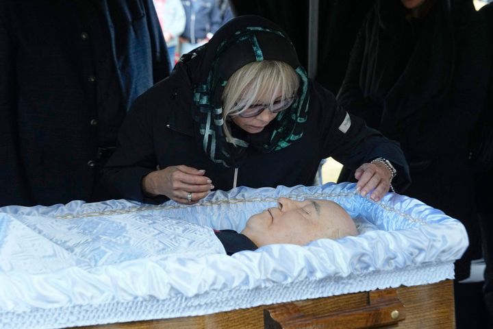 Irina Virganskaya, girl  of Mikhail Gorbachev, peers implicit    the coffin during a ceremonial   ceremonial  astatine  the Novodevichy Cemetery successful  Moscow.