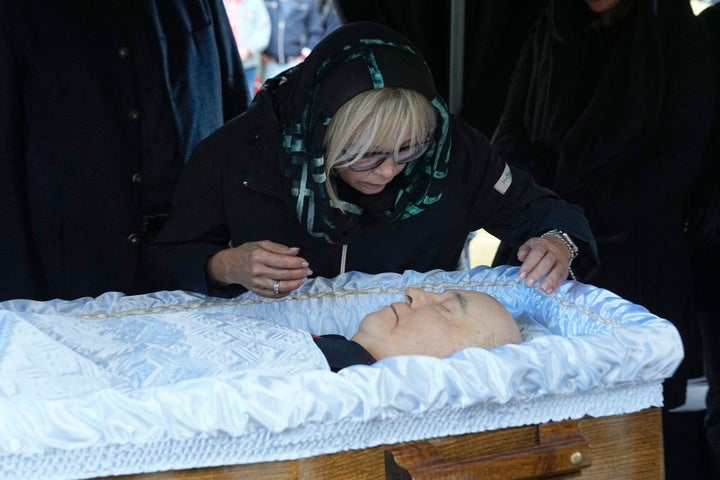 Irina Virganskaya, daughter of Mikhail Gorbachev, peers over the coffin during a funeral ceremony at the Novodevichy Cemetery in Moscow.