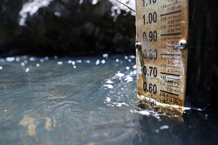 A gauge measures water levels on the Rio Nambe amid extreme drought conditions in the area on June 3, 2022 near Nambe, New Mexico. 