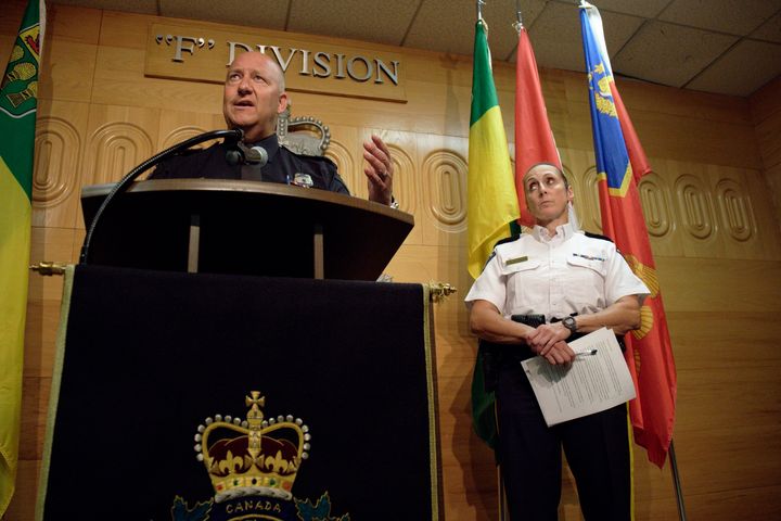 Regina Police Chief Evan Bray, left, speaks while Assistant Commissioner Rhonda Blackmore, right, looks on during a press conference at Royal Canadian Mounted Police "F" Division Headquarters in Regina, Saskatchewan, on Monday, Sept. 5, 2022. 