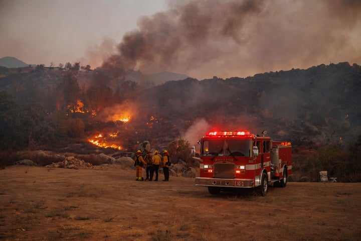 Firefighters stage in front of the Fairview Fire Monday, Sept. 5, 2022, near Hemet, Calif.