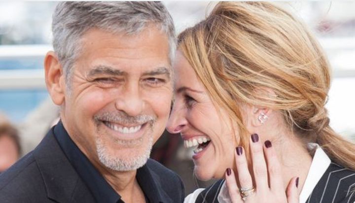 George Clooney and Julia Roberts, pictured in 2016, required dozens and dozens of takes to nail a kissing scene in their new movie Ticket to Paradise.