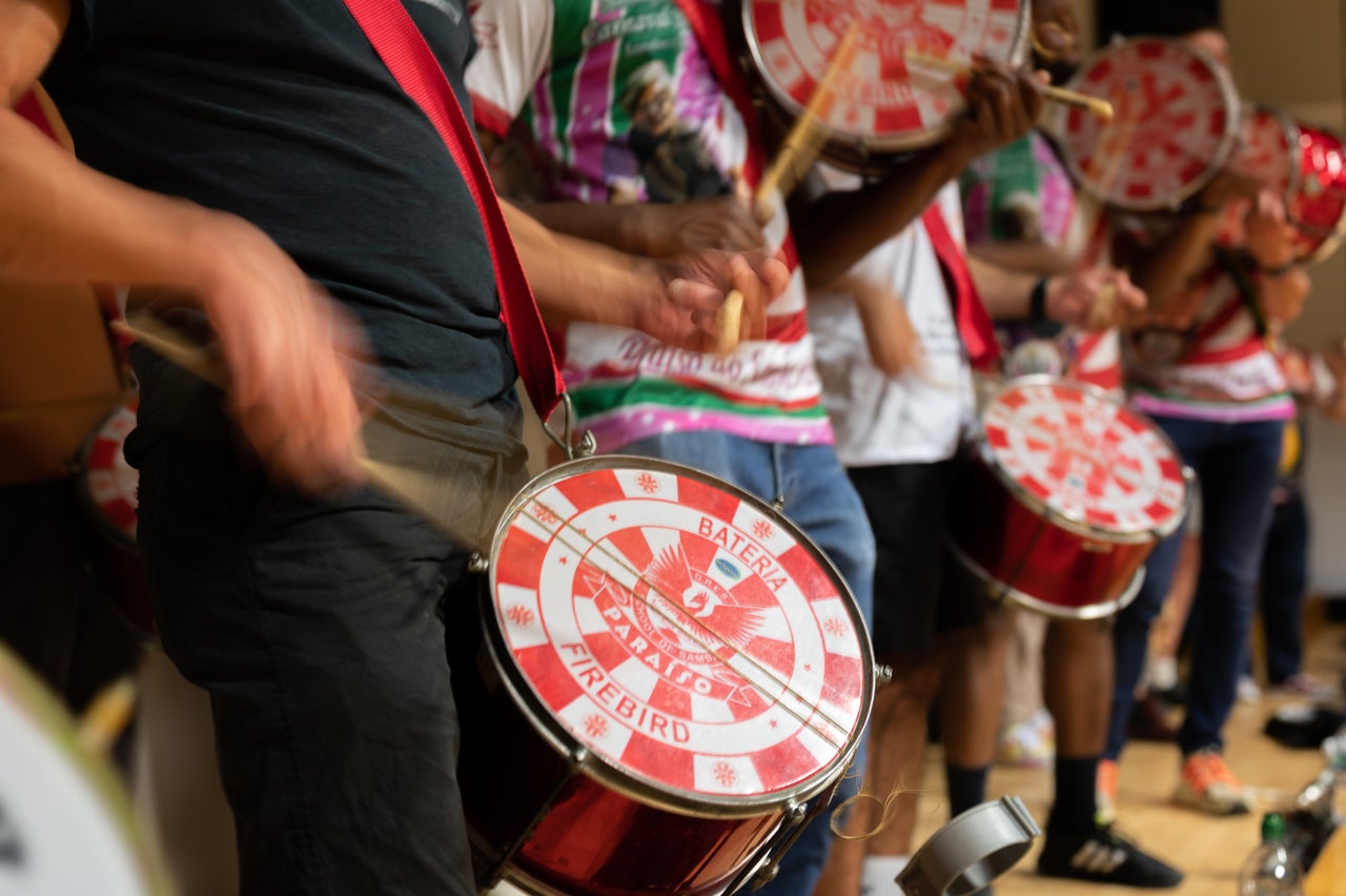 Paraiso School of Samba's Bateria accompanies Samba dancers as they rehearse ahead of the Notting Hill Carnival.