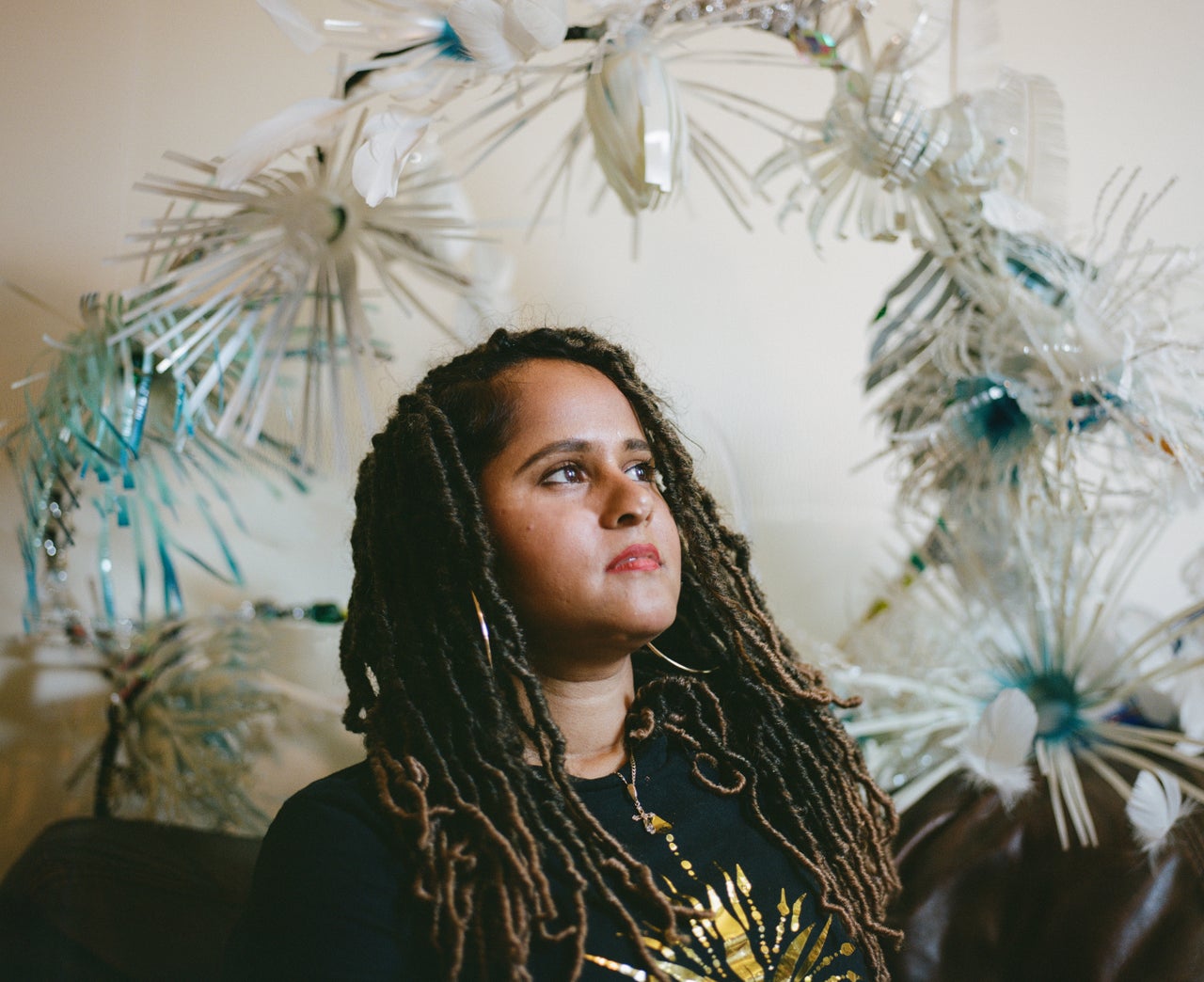 Cee Bolakee is pictured in her home studio, where she makes all of her intricate and detailed Carnival costumes. Her theme this year is inspired by the effects of climate change on coral reefs around the world, particularly her home island of Mauritius. The costumes are named after notable coral reefs to advocate for environmental sustainability, and are made of recycled materials such as plastic bottles and paper plates. “I get to express myself and see people enjoying themselves, and I have a part to play in that,” Bolakee says.