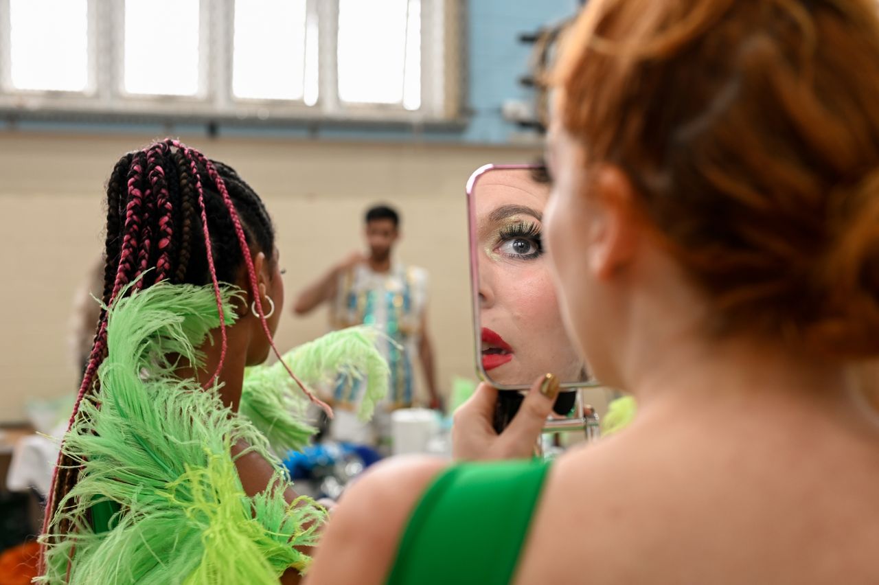 A dancer for the Paraiso School of Samba applies makeup ahead of this year's Carnival parade.