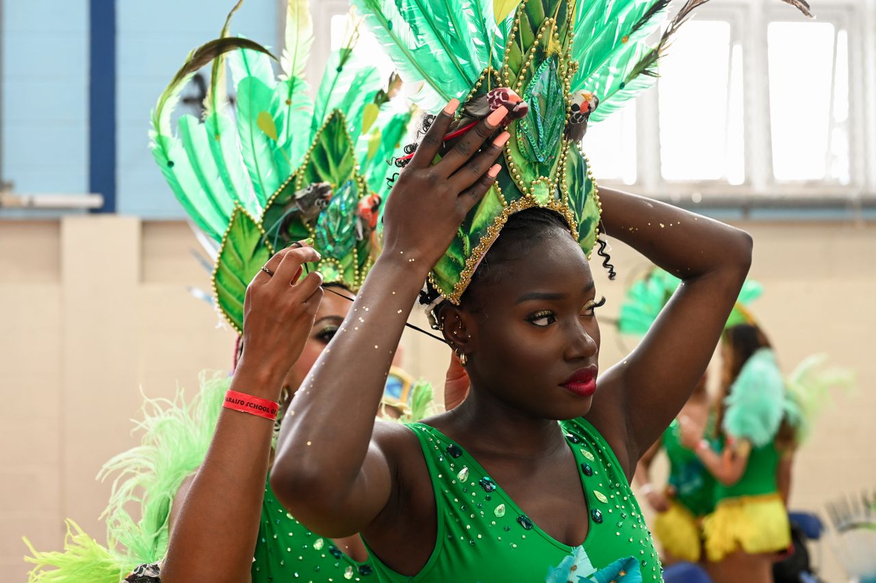 Dancers at the Paraiso School of Samba prepare to join the Notting Hill Carnival parade.