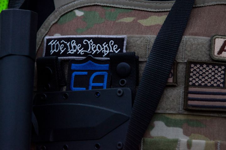 FILE: A patch from the vest of an Oath Keeper seen during a 2020 demonstration in Louisville, Kentucky.