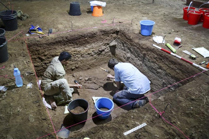 Dr Tim Maloney and Andika Priyatno work at the site in a cave in East Kalimantan, Borneo, Indonesia on March 2, 2020.