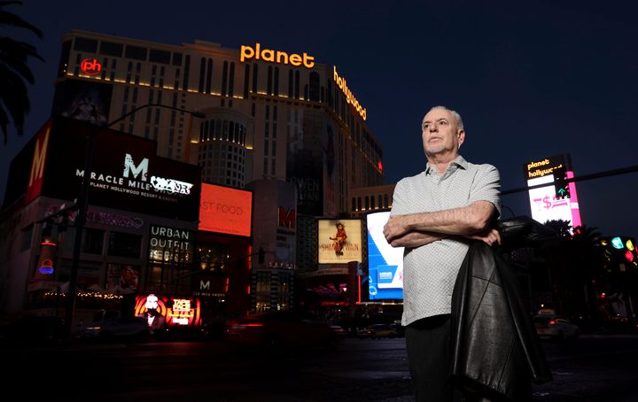 Reporter Jeff German poses with Planet Hollywood, formerly the Aladdin, in the background on the Strip in Las Vegas on June 2, 2021. 