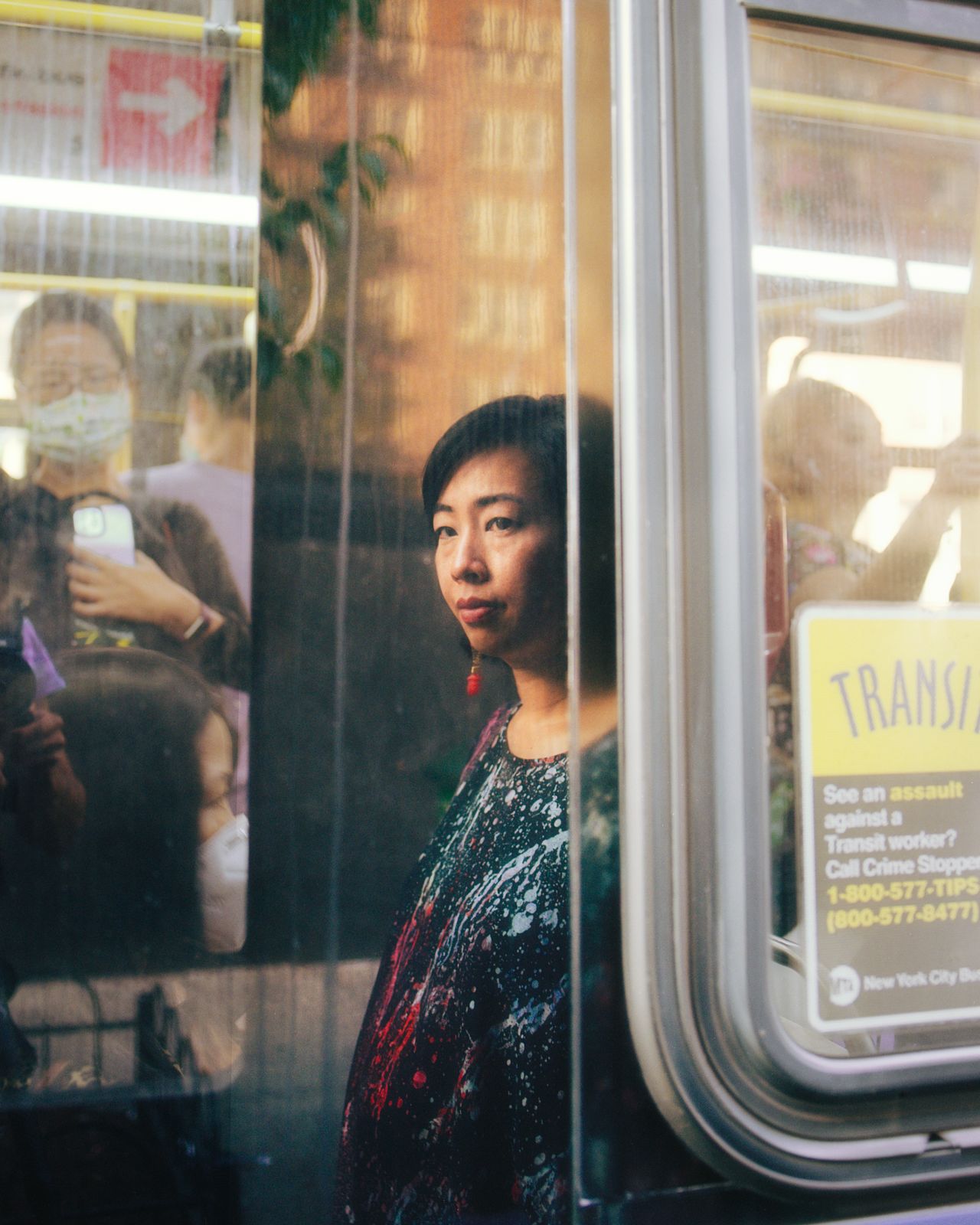 At a photoshoot in Flushing in August, Liu suddenly became emotional while sitting at the bus stop where she used to spend two hours waiting on her commute.