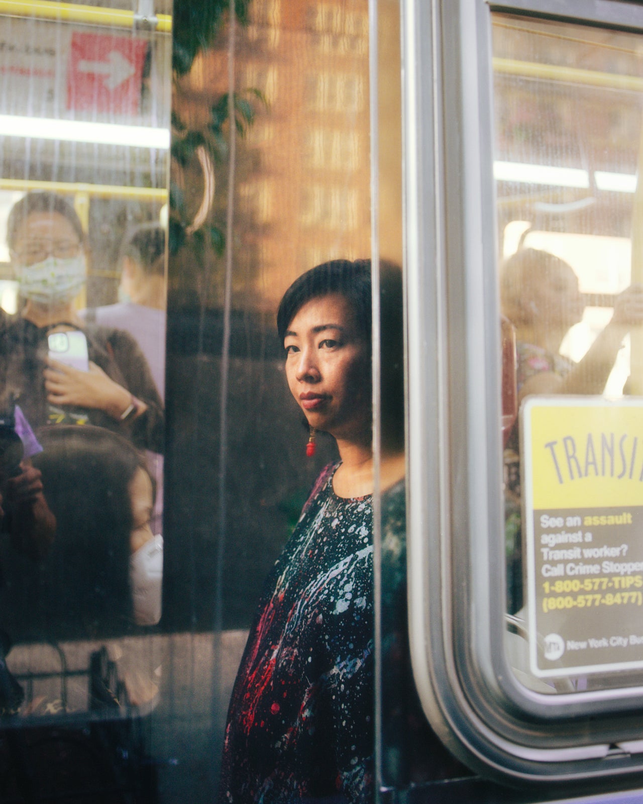 At a photoshoot in Flushing in August, Liu suddenly became emotional while sitting at the bus stop where she used to spend two hours waiting on her commute.