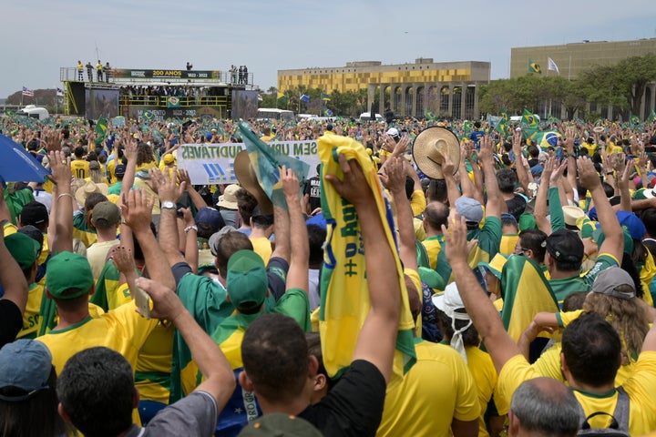 Supporters of Jair Bolsonaro listen to his speech at the Ministry Esplanade during celebrations for Brazil's 200 years of independence on Sept. 7, 2022, in Brasíia, Brazil. 