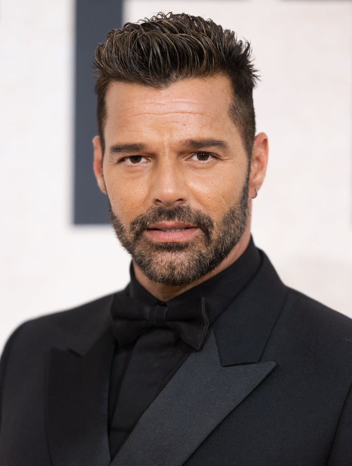 FILE: Ricky Martin attends amfAR Gala Cannes 2022 in May. The singer claims false sexual abuse allegations against him have cost him millions of dollars in lost income.