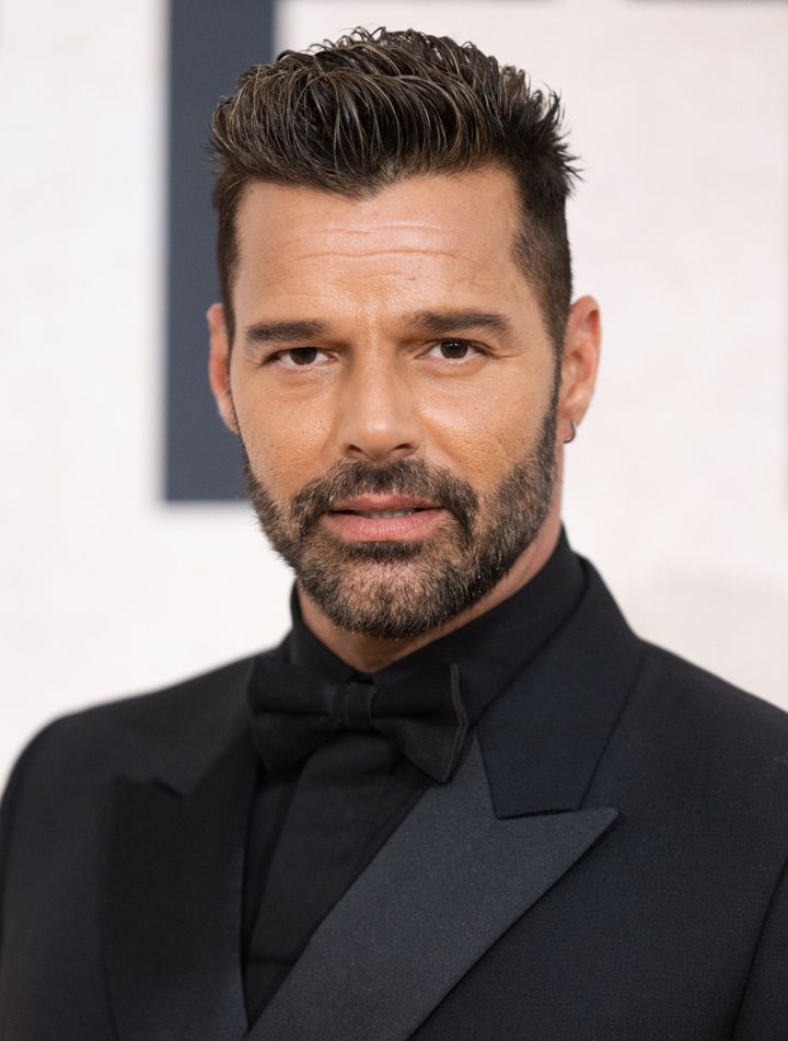 FILE: Ricky Martin attends amfAR Gala Cannes 2022 in May. The singer claims false sexual abuse allegations against him have cost him millions of dollars in lost income.
