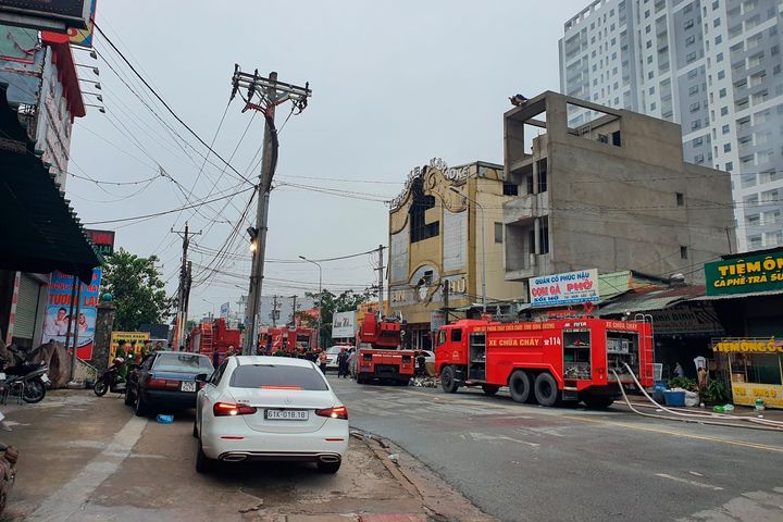 Fire trucks remained outside the karaoke parlor until Wednesday.