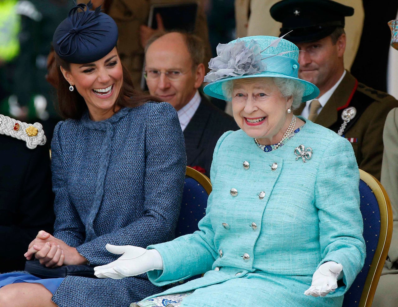 The Duchess of Cambridge and Queen Elizabeth II watch part of a children's sports event on their visit to Vernon Park in Nottingham on June 13, 2012.