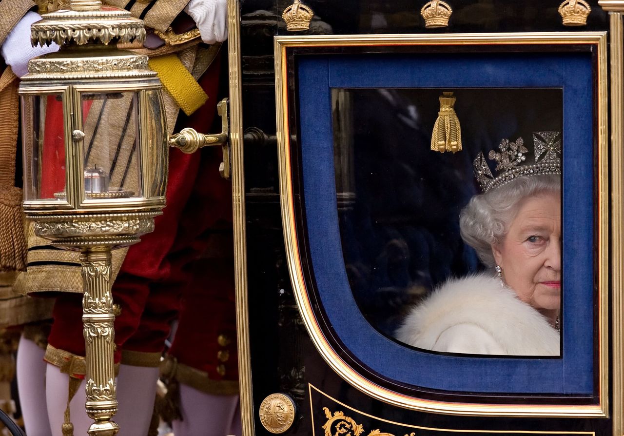 Queen Elizabeth II returns to Buckingham Palace in central London after addressing Parliament during the official State Opening of Parliament ceremony at Westminster, on November 18, 2009.