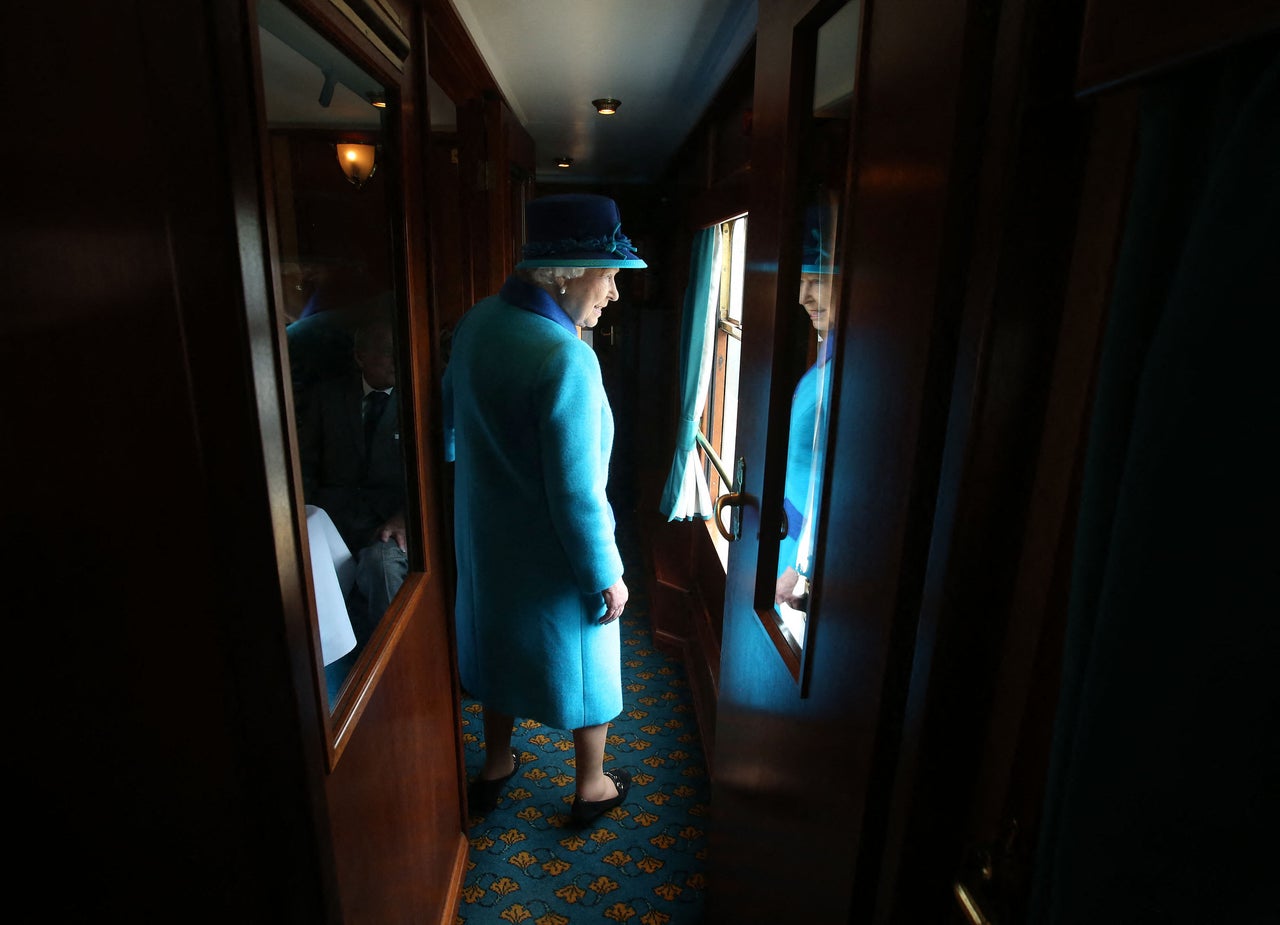 Queen Elizabeth II travels on a train pulled by the steam locomotive 'Union of South Africa' between engagements in Scotland on Sept. 9, 2015.