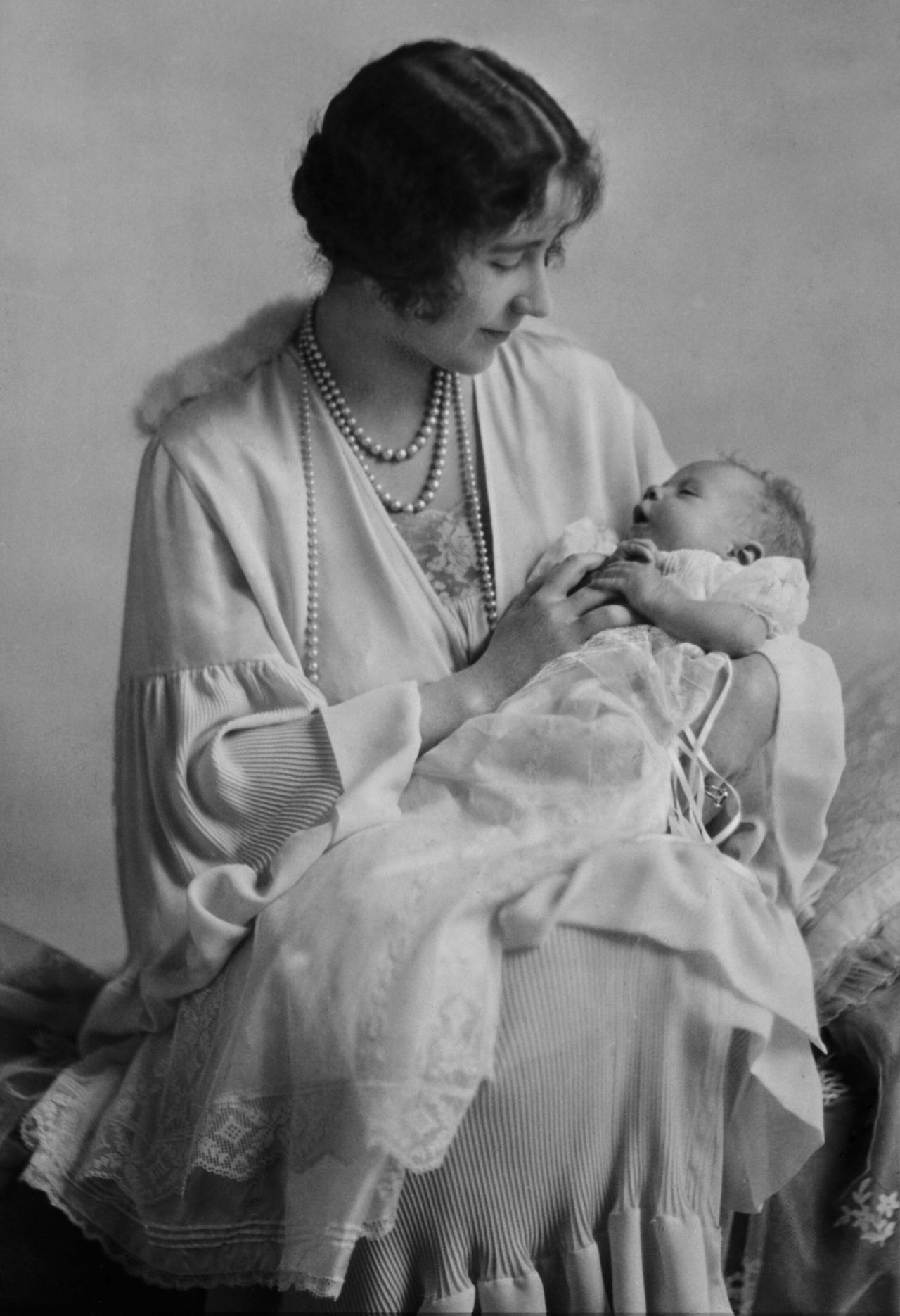 Elizabeth, Duchess of York, holds her baby daughter Princess Elizabeth, the future Queen Elizabeth II. The future queen was born in 1926.