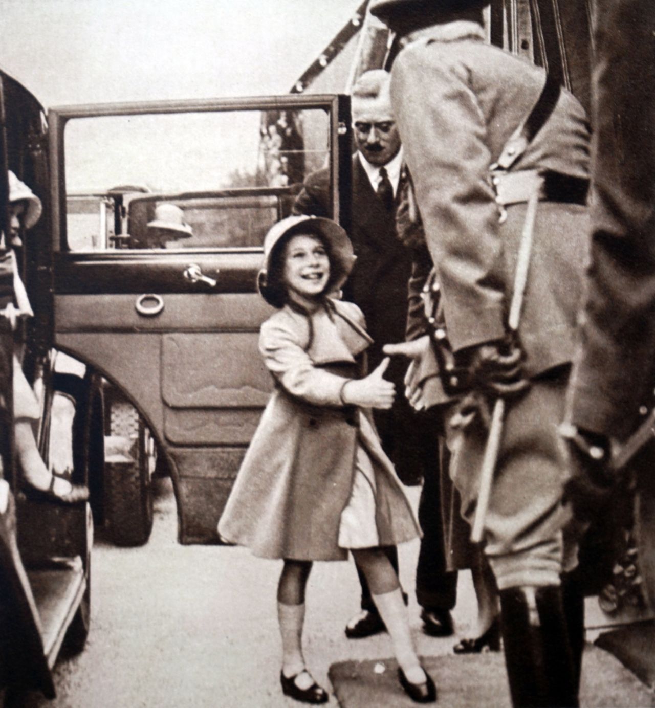 Princess Elizabeth being greeted by an official.
