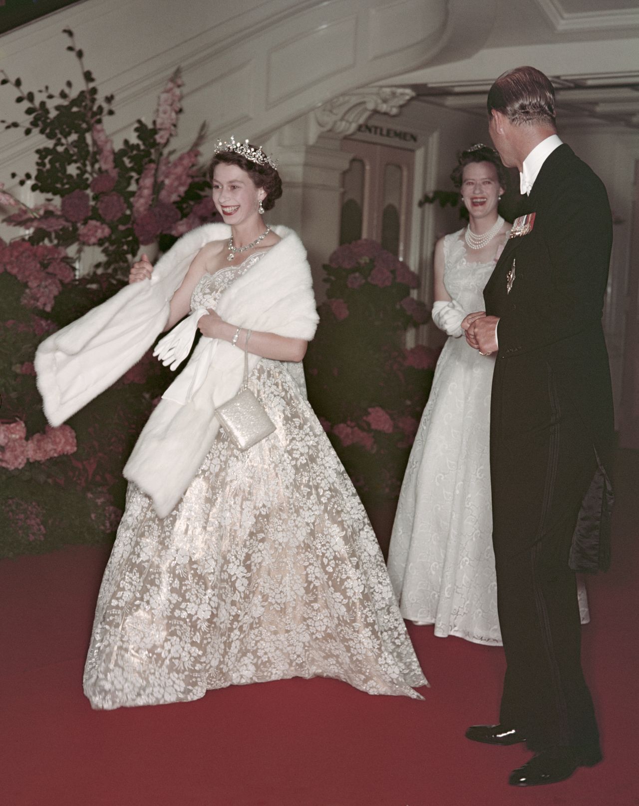 Queen Elizabeth II and Prince Philip leave a banquet during their Commonwealth visit to Australia in 1954.