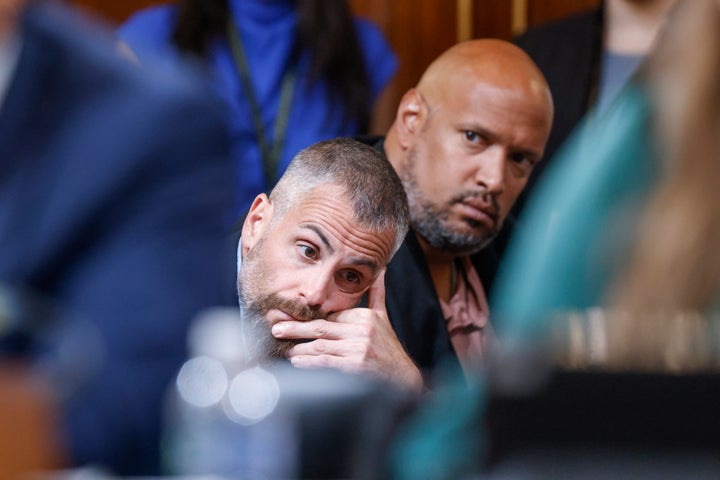 Washington Metropolitan Police Officer Michael Fanone (left) and U.S. Capitol Police Officer Harry Dunn watch as the House select committee investigating the Jan. 6 attack on the U.S. Capitol holds a July 21 hearing on Capitol Hill.