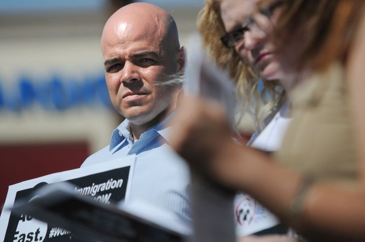 Robert Telles at a March 2014 event outside the office of U.S. Rep. Joe Heck (R-Nev.) in protest of Congress not taking action on comprehensive immigration reform. Police have arrested Telles in connection with the murder of a Las Vegas reporter.