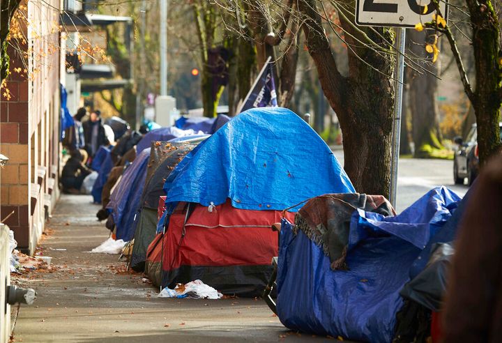 People with disabilities in Portland have filed a class action lawsuit in federal court, Thursday, Sept. 8, 2022, claiming the city has failed to keep sidewalks accessible by allowing homeless tents and encampments to block sidewalks. (AP Photo/Craig Mitchelldyer, File)
