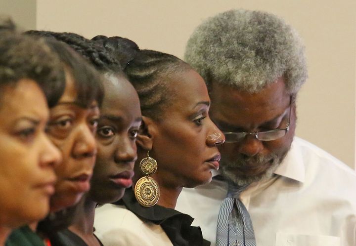 Robert Champion's mother (second from right) and father listen during a trial over their son's death in October 2014.