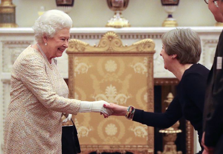 Queen Elizabeth II greets former prime minister Theresa May in 2018.