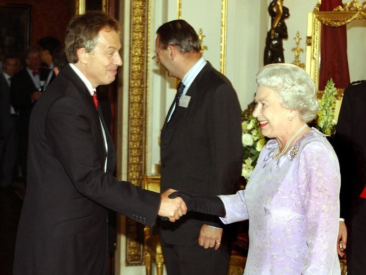 Queen Elizabeth II greets former prime minister Tony Blair.