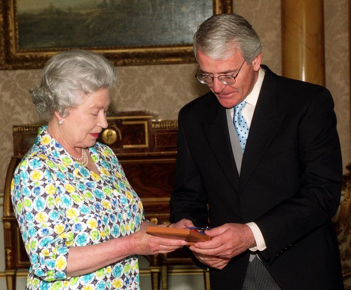 Former prime minister John Major with the Queen.