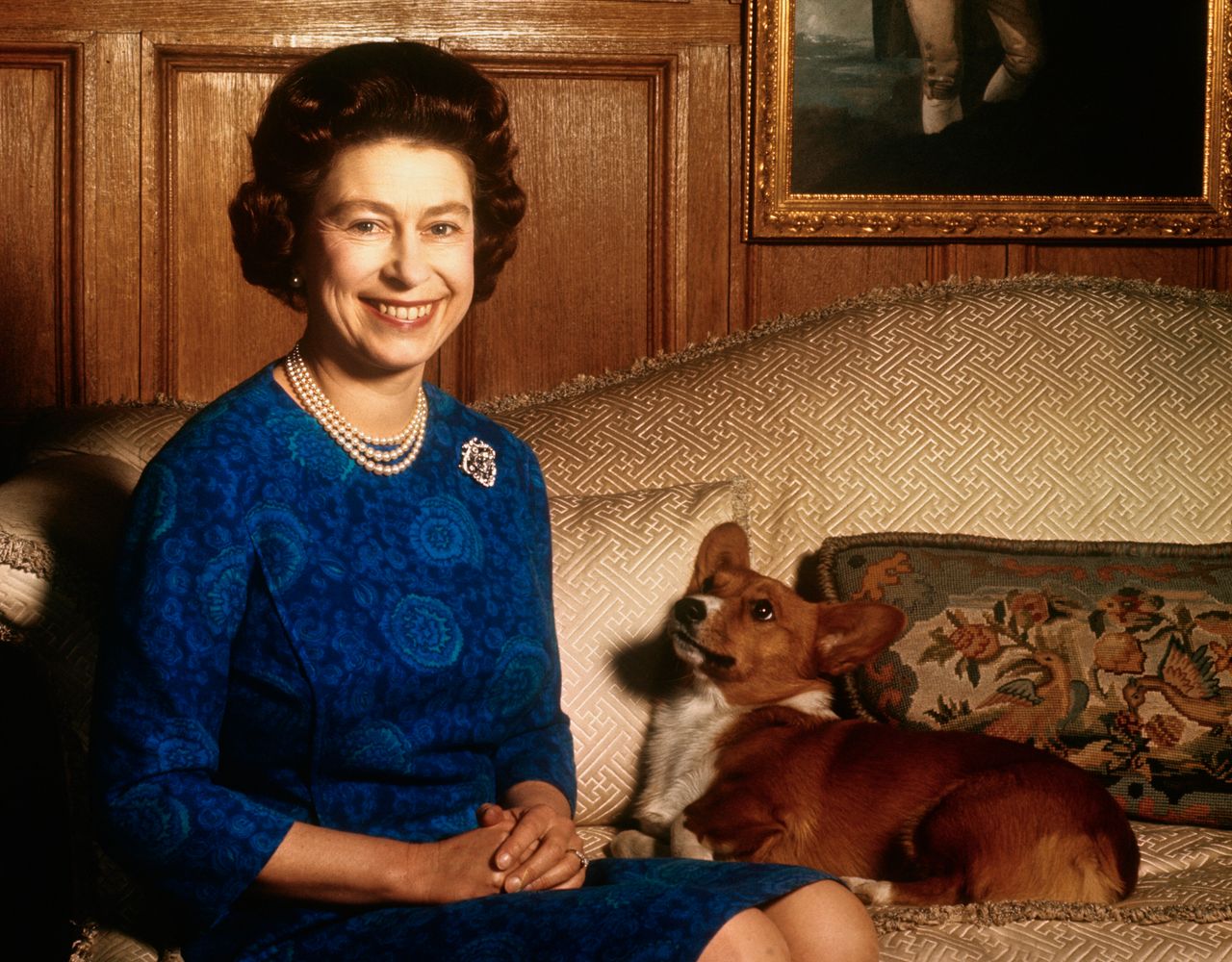 Queen Elizabeth II smiles in the salon at Sandringham House.