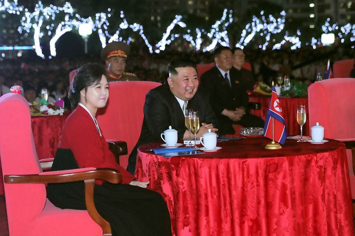 This photo provided by the North Korean government shows North Korean leader Kim Jong Un, center, and his wife Ri Sol Ju, left, watch a performance during a celebration marking the nation's 74th anniversary in Pyongyang, North Korea, on Sept. 8, 2022. Independent journalists were not given access to cover the event depicted in this image distributed by the North Korean government. 