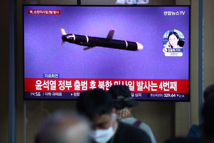 People watch a television screen showing a file image of a North Korean missile launch at the Seoul Railway Station on Aug. 17, 2022 in Seoul, South Korea.