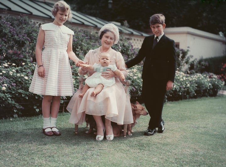 Queen Elizabeth, the Queen Mother (1900 - 2002) sits with her grandchildren Prince Charles, Princess Anne and baby Prince Andrew, the children of Queen Elizabeth II, 1960. 