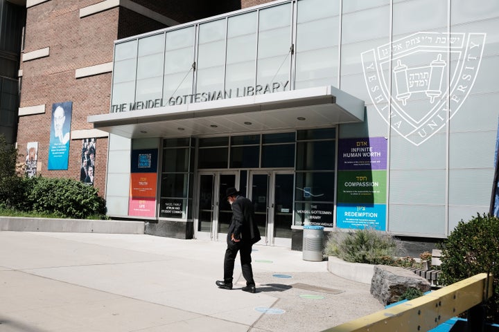 People walk by the campus of Yeshiva University in New York City on August 30, 2022 in New York City.