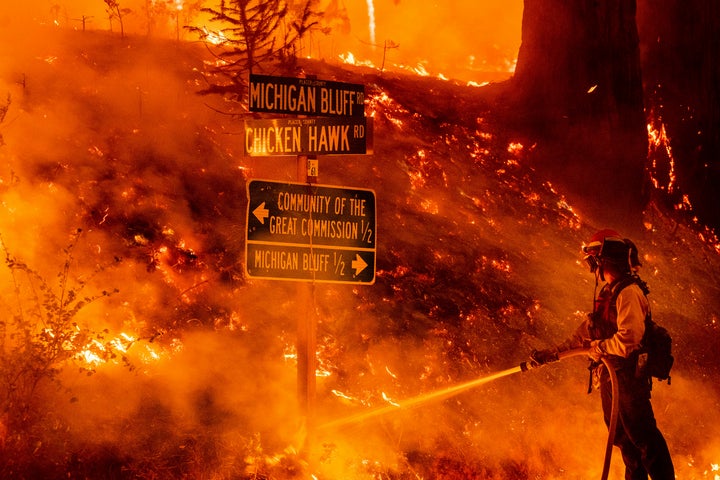 A firefighter battles the Mosquito Fire burning near the Michigan Bluff community in unincorporated Placer County, California, on Wednesday, Sept. 7, 2022.