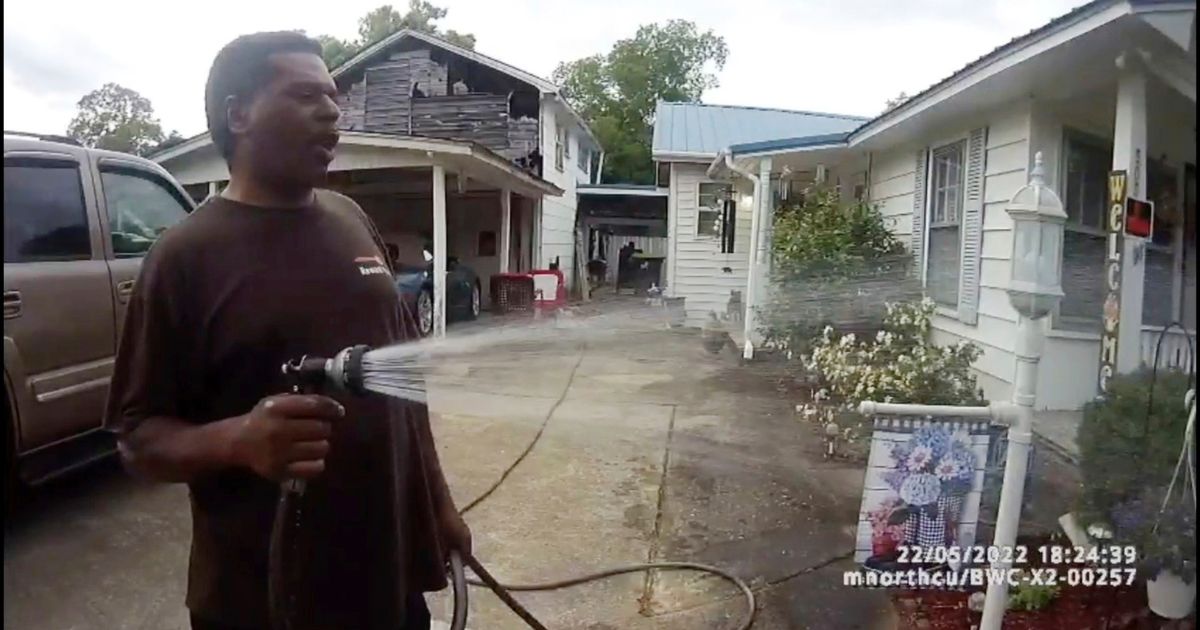Black preacher who fed flowers arrested, police sued