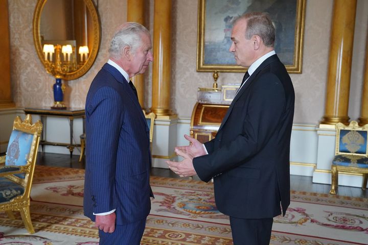 King Charles III speaks with Lib Dem leader Sir Ed Davey during an audience with opposition leaders at Buckingham Palace on September 10, 2022.