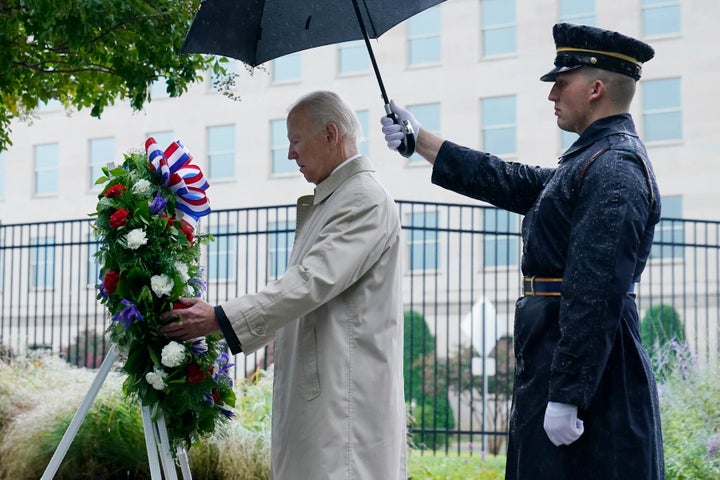 President Joe Biden participates in a wreath laying ceremony while visiting the Pentagon in Washington on Sunday to honor and remember the victims of the September 11th terror attack.