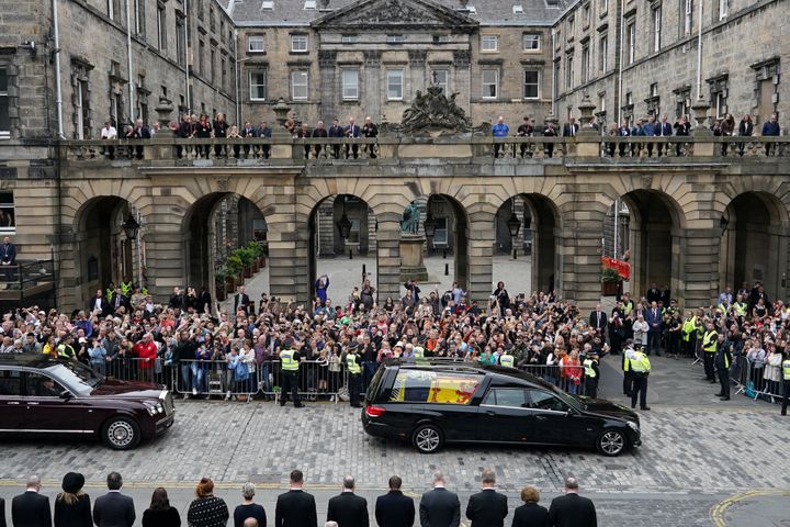 Crowds watch the cortege carrying the coffin of Britain's Queen Elizabeth in Edinburgh, Scotland, Britain, September 11, 2022. Ian Forsyth/Pool via REUTERS