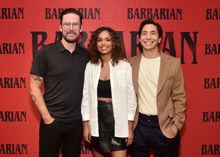 Director Zach Cregger poses alongside actors Georgina Campbell and Justin Long at a screening of"Barbarian." 