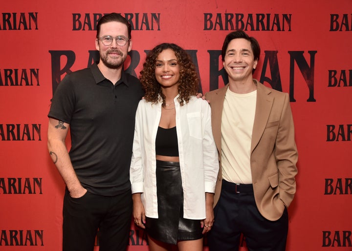 Director Zach Cregger poses alongside actors Georgina Campbell and Justin Long at a screening of"Barbarian."