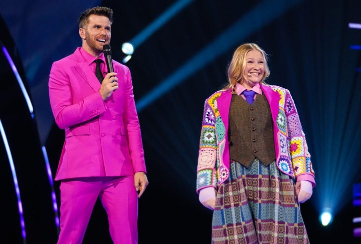 Joanna Page with Masked Dancer host Joel Dommett after her unmasking