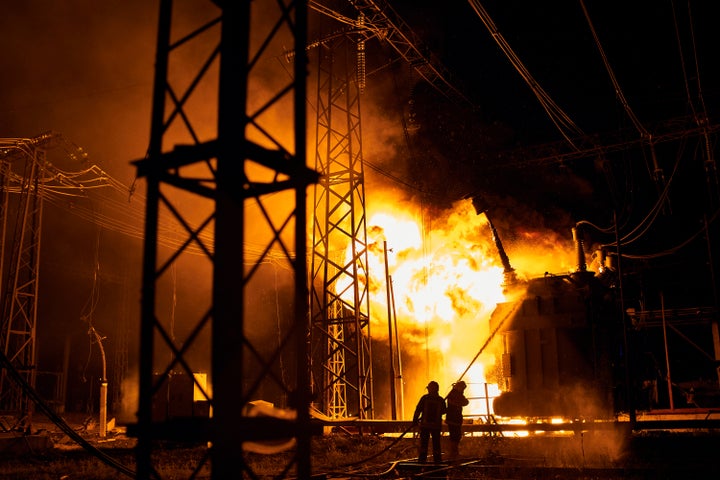 Ukrainian State Emergency Service firefighters put out the fire after a Russian rocket attack hit an electric power station in Kharkiv, Ukraine, on Sept. 11, 2022.