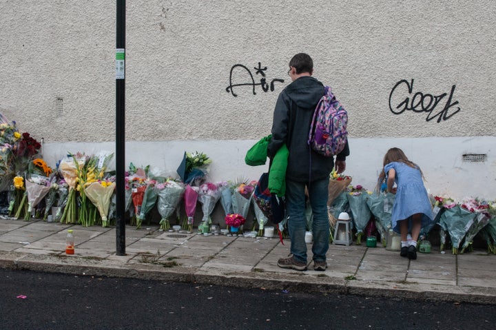 Floral tributes are left in Kirkstall gardens following the shooting of Chris Kaba, also know as the rapper Madix on September 8, 2022