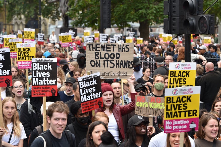 Protesters hold placards expressing their opinion during the rally on Saturday