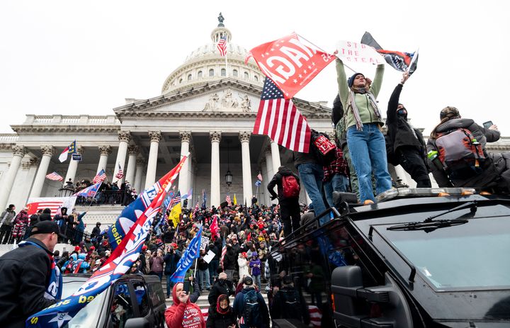 Trump supporters basal   connected  a U.S. Capitol Police armored conveyance  arsenic  others instrumentality     implicit    the steps of the Capitol during the Jan. 6, 2021 rally.
